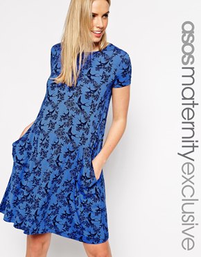 Vestido de tecido, solto, mas arrumado. Imagem: Asos